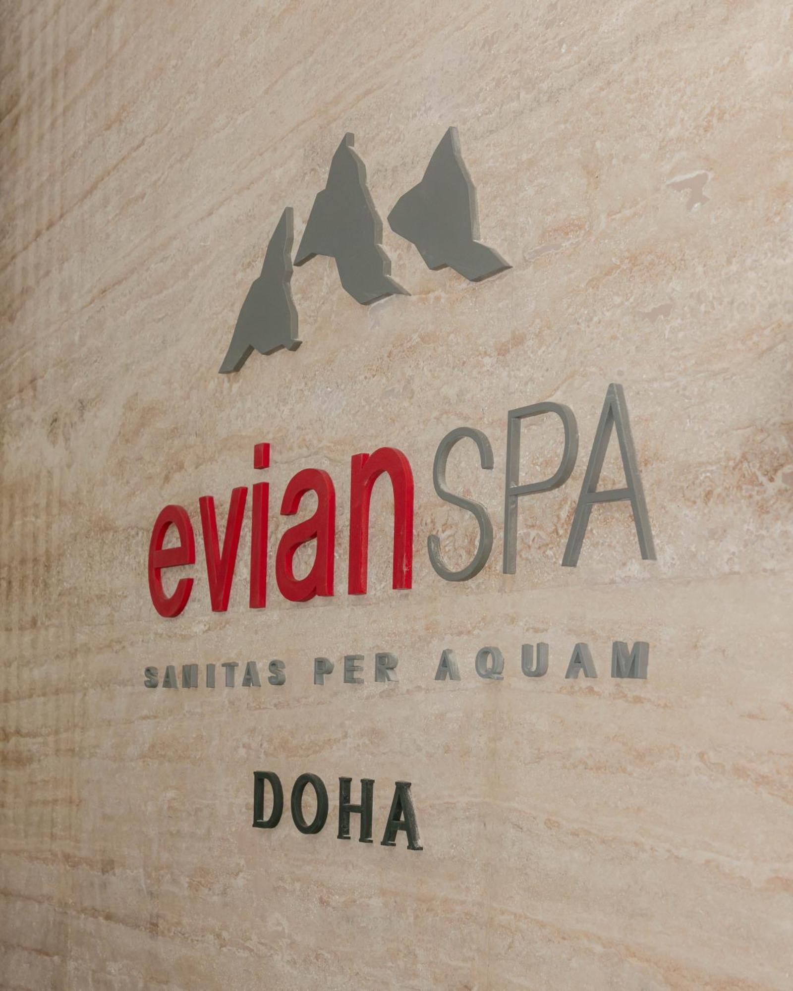 The Bentley Luxury Hotel & Suites Doha Exterior foto Evian Spa logo